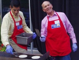Two Men Grilling Together