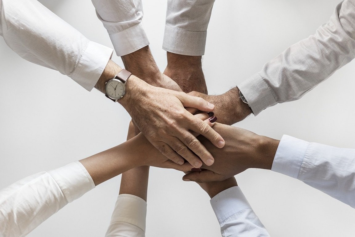 hands-together-business-team | Team Building Activities & Techniques